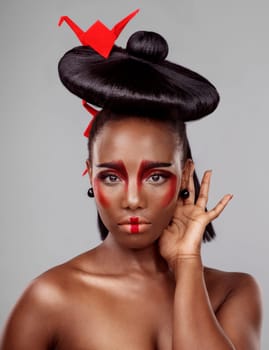 Creative beauty, face and black woman with origami in studio isolated on dark background. Portrait, makeup and skincare with African female person, traditional and Japanese paper for art deco.