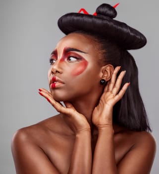 Black woman, fashion and geisha makeup in studio for art, confidence or thinking on gray background. African female person, hands and Japanese style for glamour, attraction and elegance or cosmetics.