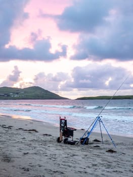 20 man are competing in a fishing competition on the beach