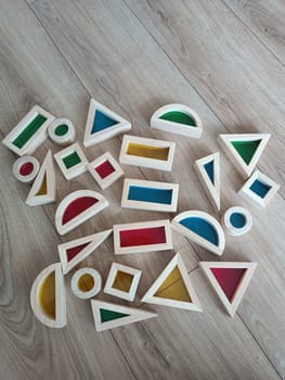 Close up wooden montessori toys colourful blocks open play kids playing. High quality photo