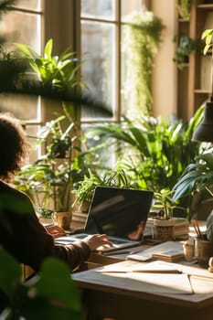 Person working peacefully on a laptop in a home office surrounded by lush houseplants