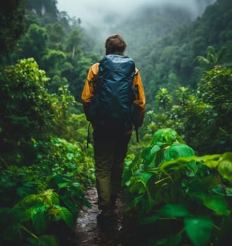 Backpacker trekking a lush jungle path in the rain, surrounded by vibrant green foliage