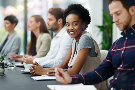 Portrait, businesswoman and team for discussion, plan and strategy for financial report. Employees, smile and talking about agenda at table for meeting, notebook and collaboration for project.