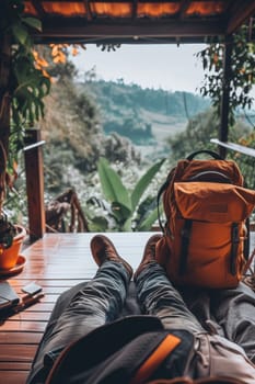 Traveler relaxing with legs stretched out in a cozy retreat overlooking a scenic mountain view