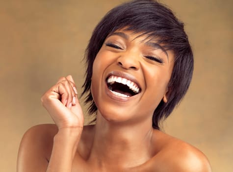 Beauty, skincare and black woman in studio, laughing and carefree with natural makeup on face. Dermatology, cosmetics and happy girl with facial care, skin glow and confidence on brown background.