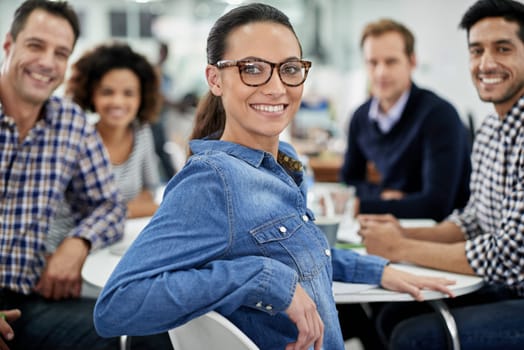 Coworking, woman and portrait of creative meeting with teamwork on writing project. Confident, writer and people in collaboration editing news, article or planning newspaper in journalist office.