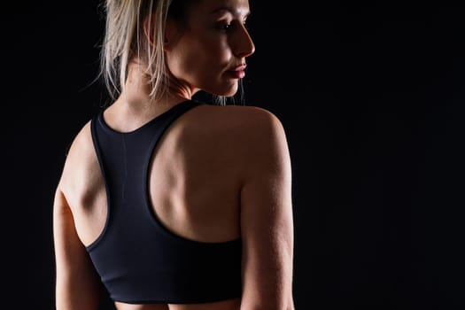 Middle aged woman doing fitness workout, standing on activewear with abs and muscles, smiling happy