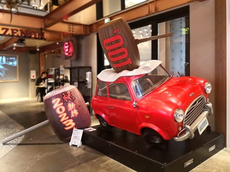 tokyo, japan - apr 25 2024: Ryo Saeba aka Nicky Larson's Mini Cooper crushed by a mallet from Japanese manga and anime City Hunter at Zenon gallery for the 40th anniversary career of Tsukasa Hojo.