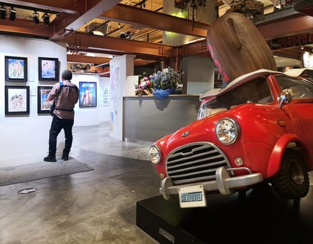tokyo, japan - apr 25 2024: Ryo Saeba aka Nicky Larson's red Mini Cooper from Japanese manga and anime City Hunter at the entrance of the Zenon gallery for the 40th anniversary career of Tsukasa Hojo.