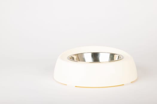 A sleek, isolated pet bowl designed for cat and dog, featured on a bright white background. This circular metallic tray ensures clean and fun mealtime for your furry friends.
