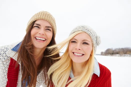 Friends, girls and happy together in snow to explore or have fun on vacation in Canada in Christmas season. Woman, outdoor and travel on winter holiday getaway for adventure or bonding with love