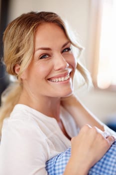 Woman, sofa and portrait with smile in home for relax, calm or recharge for wellness. Closeup, vacation or female person with happiness or laugh in house, joy for holiday in Manchester or England.