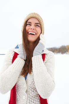 Woman, laugh and fashion in outdoor snow, warm clothes and designer jersey or season outfit. Female person, comedy and cold weather on holiday or vacation, winter style and beanie aesthetic in Norway.