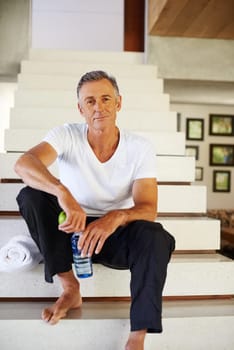 Mature man, portrait and stairs for workout, fitness and wellness for health and smile. Guy, apple and water for food, nutrition and hydration with diet happiness and training for cardio exercise.