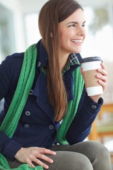 Woman, thinking and happy with coffee in house for morning routine in winter to warm up and relax for cozy ambiance. Girl, caffeine beverage and indoor bliss in home for contentment and chilling