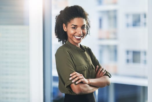 Happy black woman, portrait and window with confidence in job or career for business management at office. Female person or young creative with smile for pride, ambition or startup at workplace.