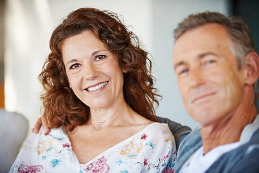 Portrait, happy woman and couple in home together for love, connection or relax in living room. Face, man and smile of mature partner in lounge for care, commitment and healthy relationship in house.