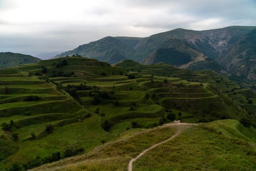 Chokhsky terraces Dagestan. Landscape of mountainous Dagestan with terraced fields and peaks mountains in the distance