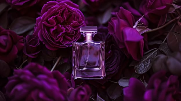 Perfume bottle in flowers, fragrance on blooming background, floral scent and cosmetic product idea