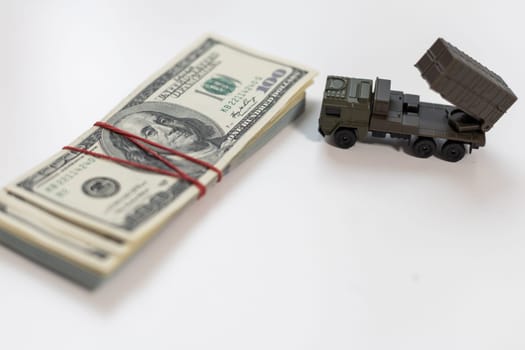 concept four rockets sent upwards against a hundred dollar banknote money background. Weapons of mass destruction, nuclear warhead, chemical charge. armament. High quality photo