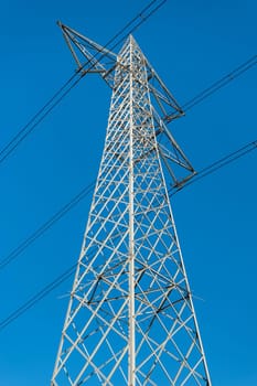 High voltage pylon. High-voltage tower sky background.