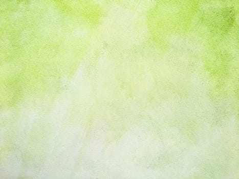 Concrete lime green colorful wall surface texture. Abstract grunge bright illuminating color background. Copyspace.