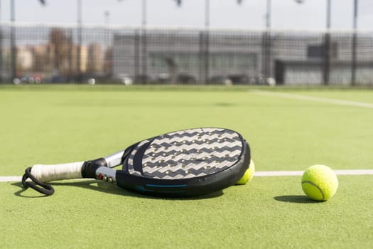 Paddle tennis racket and ball. High quality photo