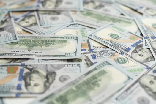 Very big amount of US hundred dollar bills close up. Huge quantity of united states currency notes on flat table. High quality photo