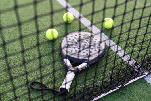 Ukraine Kyiv - March 30, 2024. Paddle tennis racket and ball. High quality photo