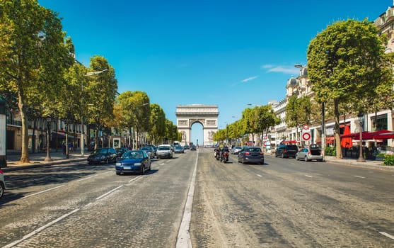 Road of Champs Elysee leading to Arc de Triomphe in Paris, France