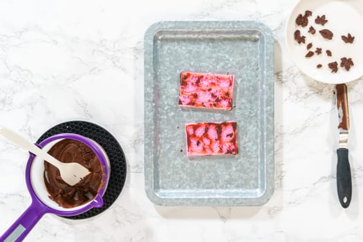 Flat lay. Making chocolate leaves from melted chocolate to decorate the pumpkin bundt cake.