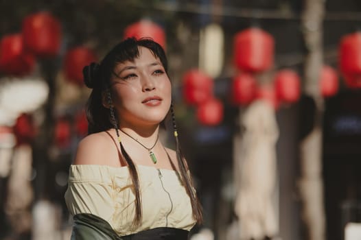 Portrait of an Asian woman against the background of Chinese lanterns