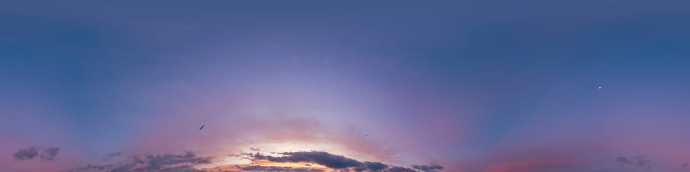 Dramatic Sunset sky 360 panorama. Vibrant sky with bright glowing red pink Cumulus clouds. HDR 360 seamless spherical panorama. Sky dome for aerial drone panoramas. Climate and weather change