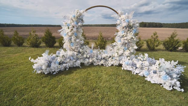 White wedding arch before the ceremony