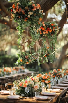 A table with a lot of flowers and a lot of wine glasses. The table is set for a party