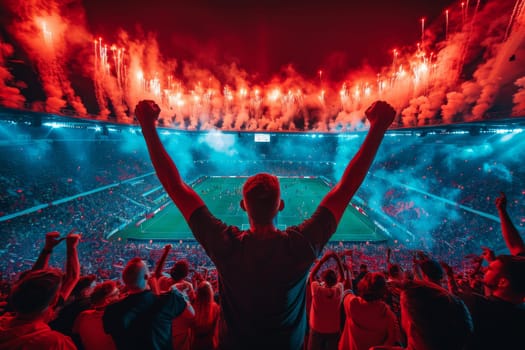 A man is standing in a stadium with a crowd of people around him. He is holding his arms up in the air, and there are fireworks in the background. Scene is celebratory and energetic, as the man