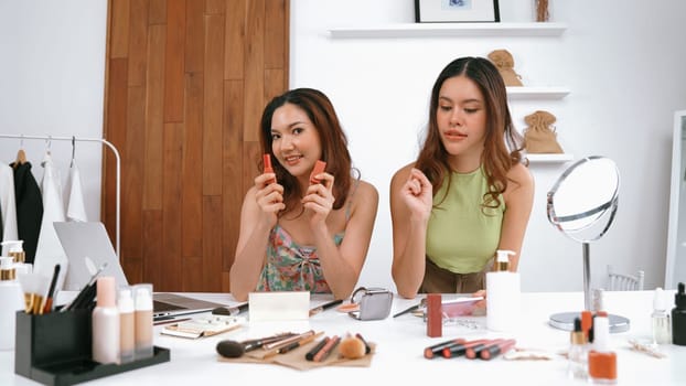 Two influencer partner shoot live streaming vlog video review makeup social media or blog. Happy young girl with vivancy cosmetics studio lighting for marketing recording session broadcasting online.