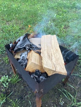 The barbecue grill is lit for the cooking outdoors