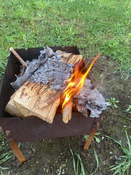 The barbecue grill is lit for the cooking outdoors