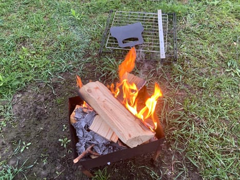 The barbecue grill is lit for the cooking outdoors