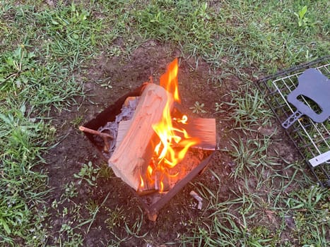 The barbecue grill is lit for the cooking outdoors