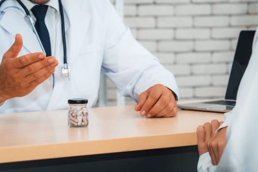 Doctor in professional uniform examining patient at hospital or medical clinic. Health care , medical and doctor staff service concept. Jivy