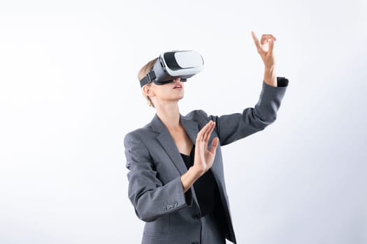 Project manager touching and managing system while using VR glasses. Caucasian business woman looking and planning strategy while standing and using visual reality headset. Technology. Contraption.
