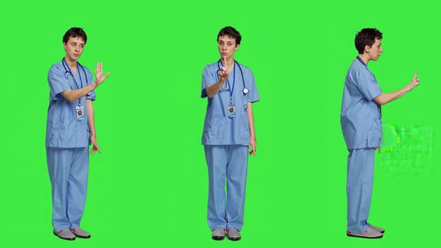 Displeased irritated nurse shouting no and arguing with someone against greenscreen backdrop, showing rage and anger while she wears hospital scrubs. Aggressive medical assistant. Camera A.