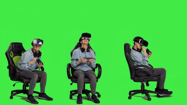 Happy gamer winning video games tournament with vr glasses, playing mobile gaming championship using her smartphone and virtual reality interactive headset. Greenscreen backdrop. Camera A.