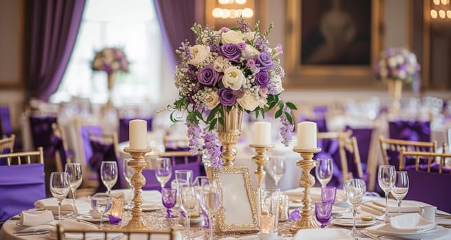 Wedding table decoration with lavender flowers, sweets, cake and candles