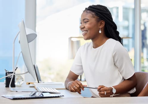 African woman, office and computer for working, research and online report for web article. Reporter, technology and smile for startup, news agency or creative writing for New York affirmative action.
