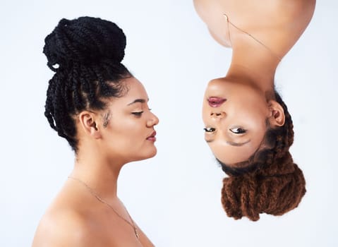 Sisters, upside down and beauty in studio, glow and luxury makeup cosmetics on white background. Women, friends and aesthetic for soft skin, dermatology and skincare bonding or confident for shine.