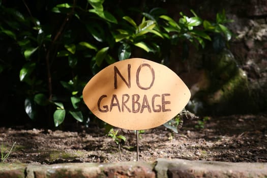 sign of no garbage in a park.