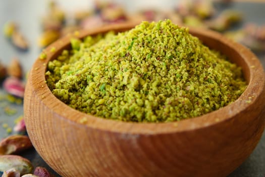 Wooden bowl filled with pistachios, a natural and nutritious superfood.